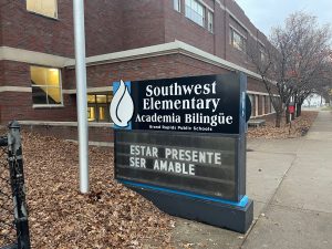 Southwest Elementary Academia Bilingüe School Sign Sign for Southwest Elementary Academia Bilingüe, a bilingual elementary school in Grand Rapids, Michigan, featuring the school's logo and a motivational message in Spanish.